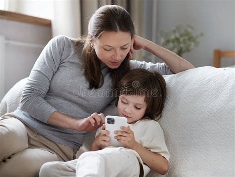 Confident Mother Learning Little Son Use Smartphone Surfing Internet