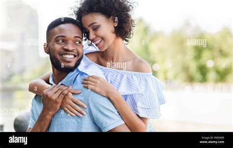 Loving African American Couple In Love Hugging In Park Stock Photo Alamy