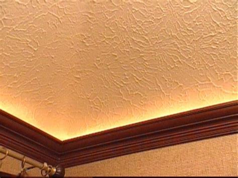 I have gotten a bajillion and one questions about what we used so here. How to Mount Crown Molding to a Tray Ceiling | HGTV