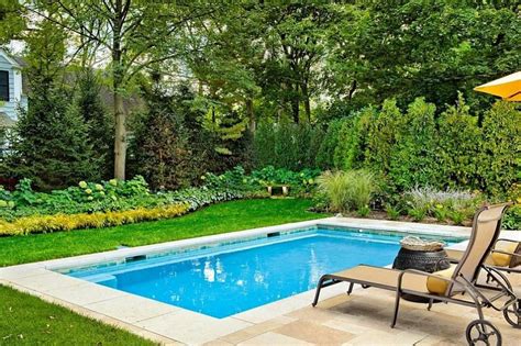 Outdoor elements maximized the available space in this beautiful yard with a contemporary, rectangular pool complete with a large tanning deck and swim jet system. 30 Best Inground Swimming Pools for Stunning Ideas | Small ...