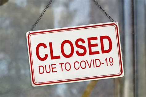 Closed Sign Due To Covid19 Coronavirus Outbreak Lockdown On The Window