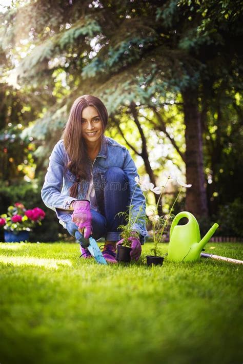 Happy Young Woman Gardening At Home In The Backyard Stock Image Image