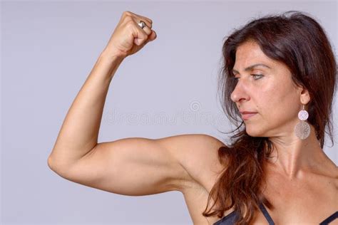 Happy Mature Woman Flexing Bicep Muscles Stock Image Image Of Flexing Modern 116635443
