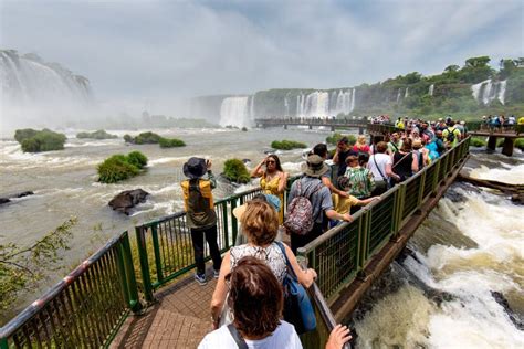 Visitors At Iguazu Falls In Argentina And Brazil Editorial Stock Photo