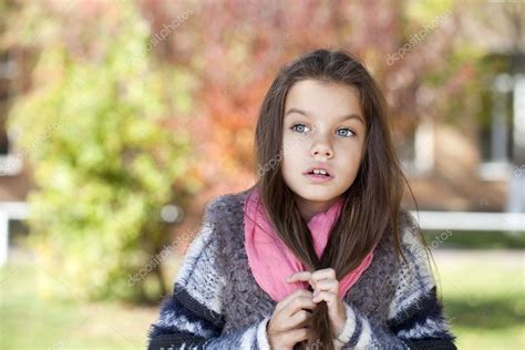 Beautifal Little Girl In The Autumn Park Stock Photo By ©arkusha 54249119