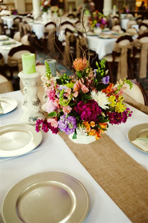 You can create the rustic look at your wedding in a couple of ways. Rustic Elegant Summer Wedding Decor Details