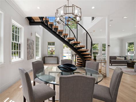 Curved Floating Stairs In Open Concept Home Modern Dining Room