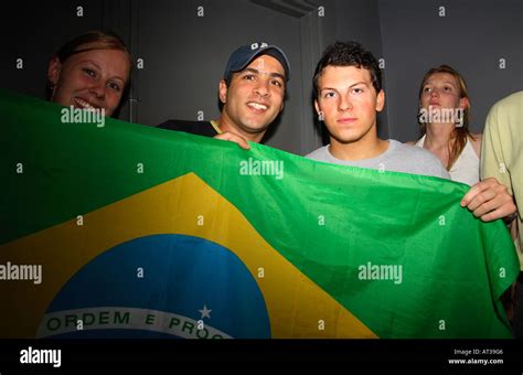 brazilian fans posing with flag during their 2006 world cup quarter final vs france on anon bar