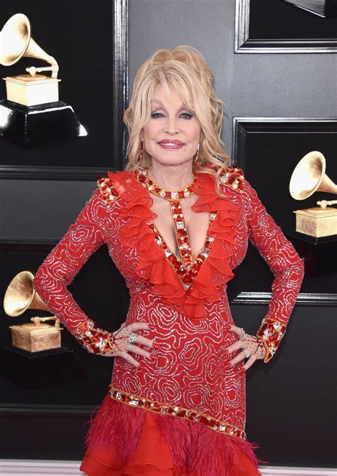 dolly parton says she would get ‘scolded and ‘whipped by her grandfather for her wardrobe choices