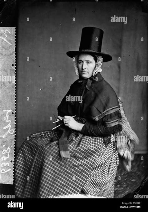 A Woman In National Dress And Knitting Jones Graphic 1 Negative