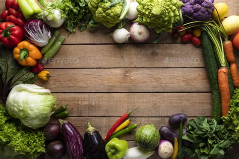 Healthy Food Vegetables On A Wooden Table Stock Photo By Nickpaschalis