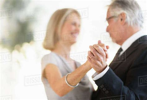 Smiling Older Caucasian Couple Dancing Stock Photo Dissolve