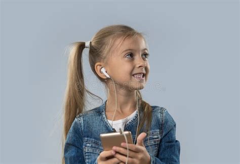 Beautiful Little Girl Using Smart Phone Listen Music Wear Earphones