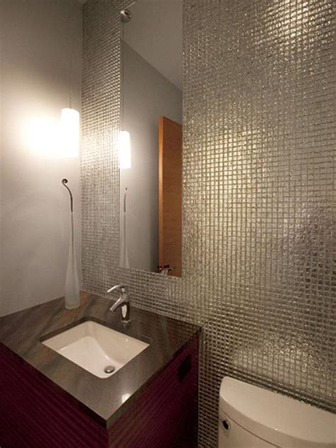 One of our favourite tile ideas for small bathrooms and cloakrooms embraces the use of the bath in making a room feel more spacious. The small bathroom with grand ideas