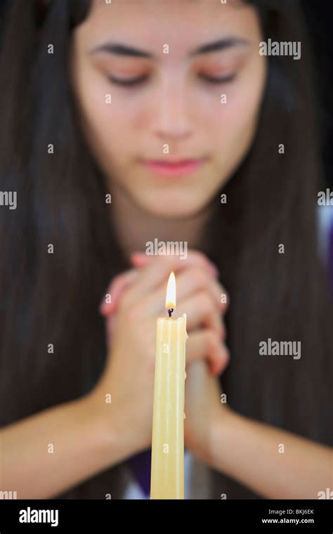 A Teenage Girl With Hands Clasped In Prayer Stock Photo Alamy