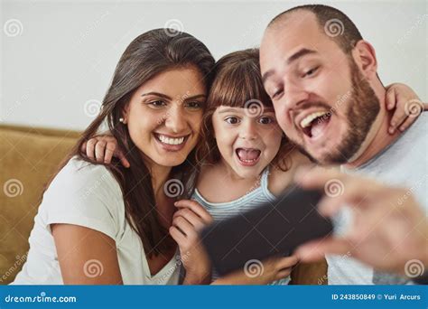 Super Happy To Spend Time With The Fam Shot Of A Mother And Father Taking Selfies Together With