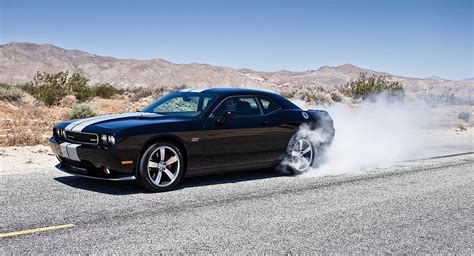 The srt in srt8 stands for street racing technology while the 8 is meant to signify the vehicle's v8 engine. 2013 Dodge Challenger SRT8 392 Burnout Status - egmCarTech