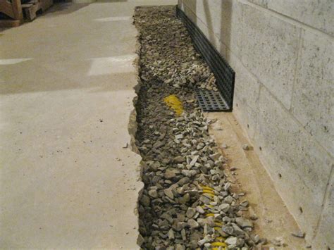 Place drain pipe atop fabric lining, then add gravel, covering pipe completely. Learn about Interior Waterproofing - Advanced Basement ...