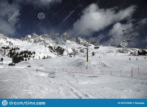 Skiers On The Slopes Of The San Pellegrino Pass In Val Di Fassa