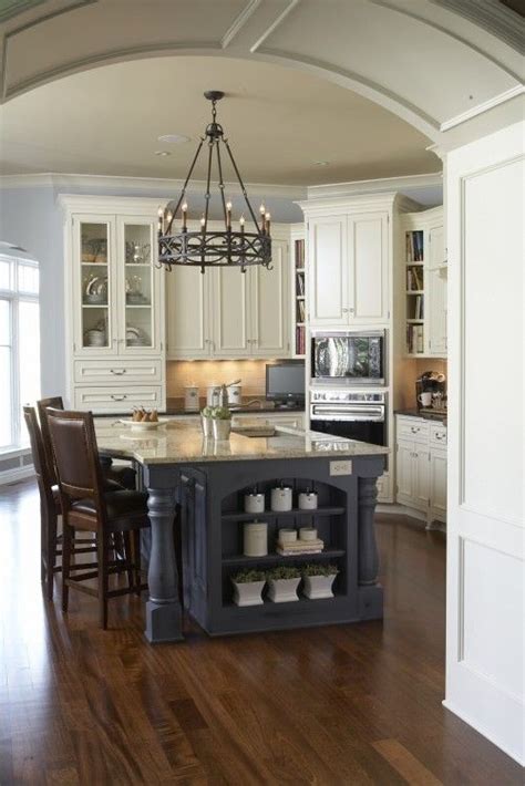 Cabinet color trends for a long time, white has dominated kitchen design. kitchen with pale blue walls and slate blue island with ...