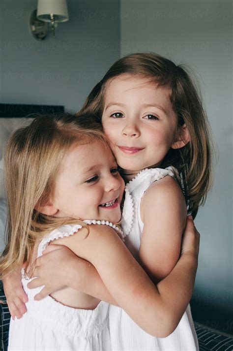Two Young Sisters Hug Pormargaret Vincent