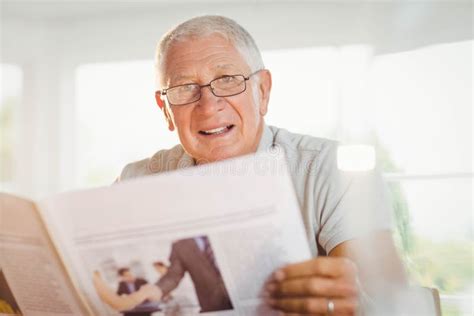 Focused Senior Man Reading Newspaper Stock Photo Image Of House