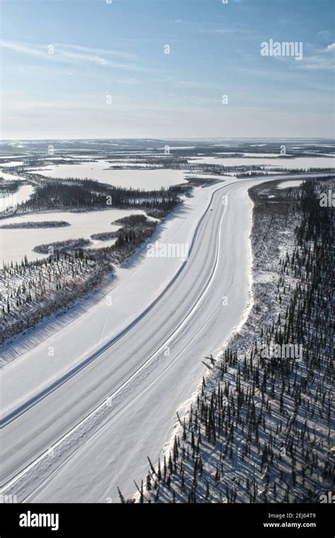 Aerial View Of Mackenzie River Ice Road In Winter Connecting