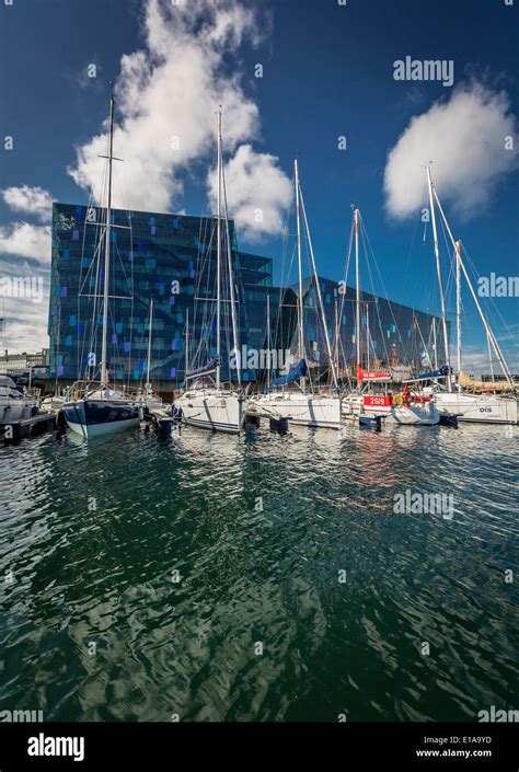 Reykjavik Harbor With Sailboats And Harpa Concert And Convention Center