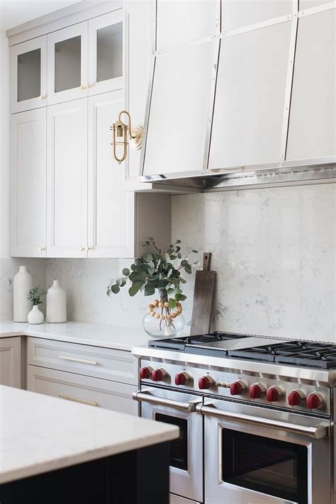 Countertops and backsplashes should have coordinating colors and designs for a cohesive design. Love the look. Classic and transitional. | Kitchen quartz ...