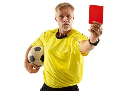 Football Referee Showing A Red Card To A Displeased Player Isolated On