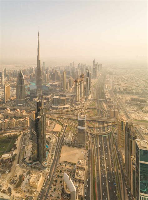 Aerial Panoramic View Of Dubai Skyscrapers Roads And Burj Khalifa