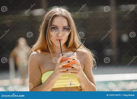Pretty Woman Drinking A Cocktail At A Pool Stock Image Image Of