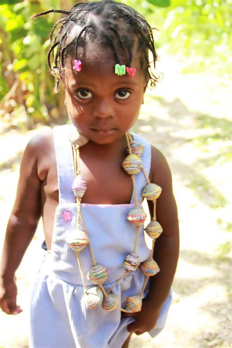 beautiful haitian girl modeling handmade jewelry from papillon beautiful