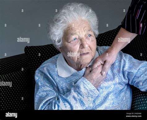 Elderly apprehensive senior old age lady at home sad bereaved medical