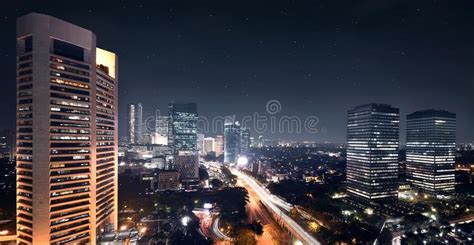 Night Scene With Bright Skyscrapers And Traffic Motion Stock Photo