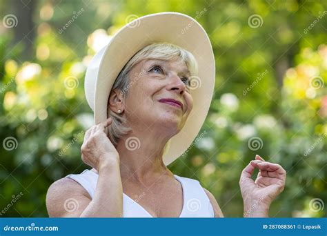 Emotional Portrait of a Woman 60-70 Years Old Beautiful Blonde in a