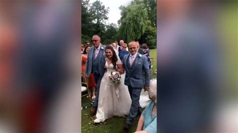 Moment Father And Stepfather Walk Bride Down The Aisle Together