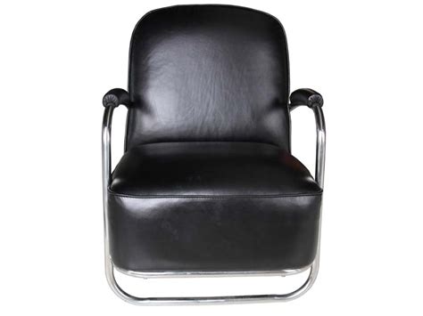 This is a roomy vintage style armchair with studs and a super comfy seat which has been aged by hand to create just the right look. Metal Base Vintage Black Leather Armchair