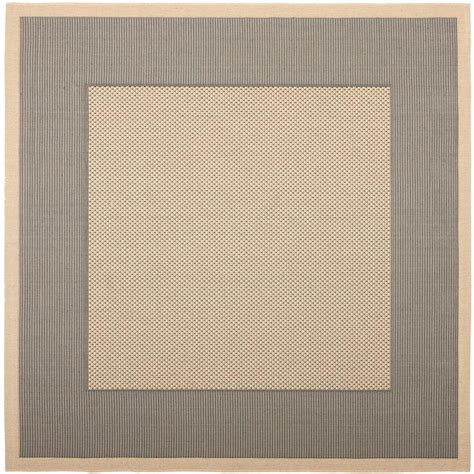 Anchor any indoor or outdoor arrangement in understated style with this versatile area rug, showcasing a contemporary color block. Safavieh Courtyard Gray/Cream 7 ft. 10 in. x 7 ft. 10 in ...