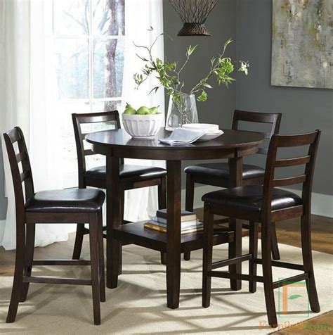 Kursi dan bangku makan dengan sandaran tinggi memberikan pengalaman duduk yang nyaman. Set Meja Makan Bundar Cafe Minimalis Klasik - Furnibel.com