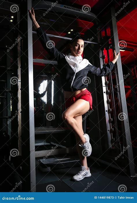 Beautiful Russian Model Fitness Shoot In Gym Doing Weight And Machine Training Stock Image
