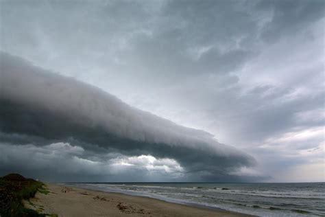 A Beautiful Shelf Cloud Or Arcus Cloud Passes Over The Beach At