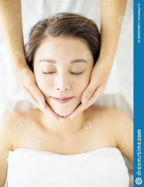 Relaxed Beautiful Young Woman Enjoy Massage In Spa Salon Stock Image Image Of Beautiful