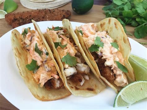 The fish—we use cod, but any flaky variety works—marinates in a mixture of lime juice, chili powder, and. Easy Fish Tacos with Spicy Slaw - Desperately Seeking Gina
