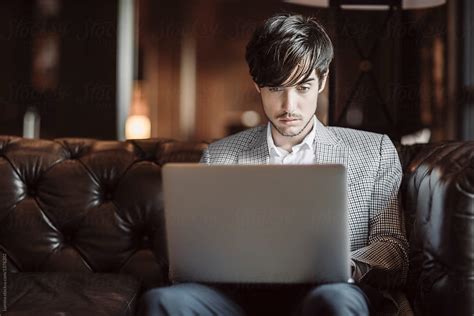Businessman Freelancer Working On Laptop By Stocksy Contributor