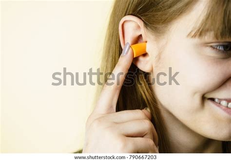 Woman Putting Ear Plugs Into Her Stock Photo Edit Now 790667203