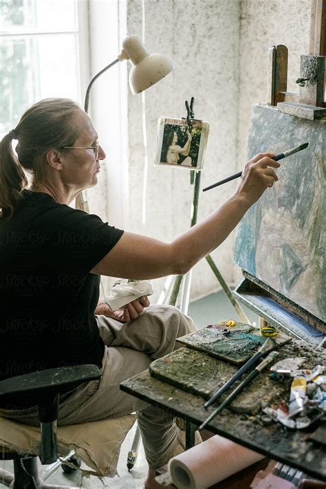 Female Artist Working On The Painting By Stocksy Contributor