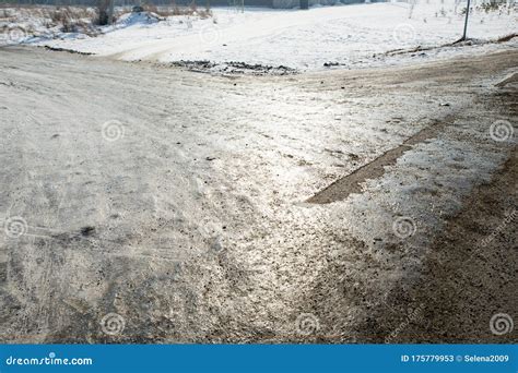 Dangerous Driving Conditions Icy Road With Tracks From The Wheels Of
