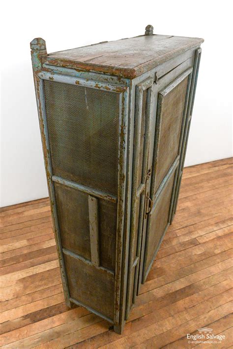 The second photo above shows a classic california cooler. Vintage wooden mesh front pantry cabinet