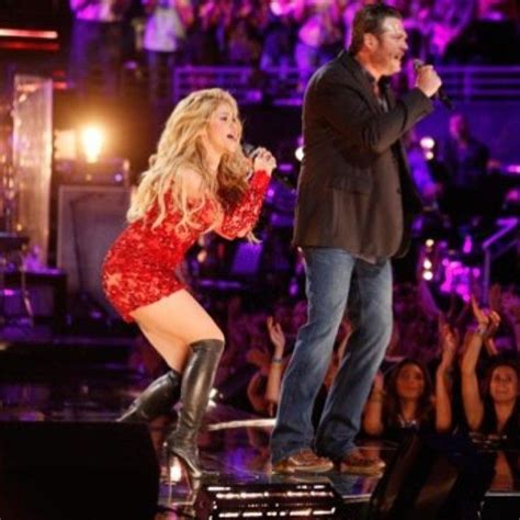last night on the voice shakira performed her single medicine with blake shelton weari… red
